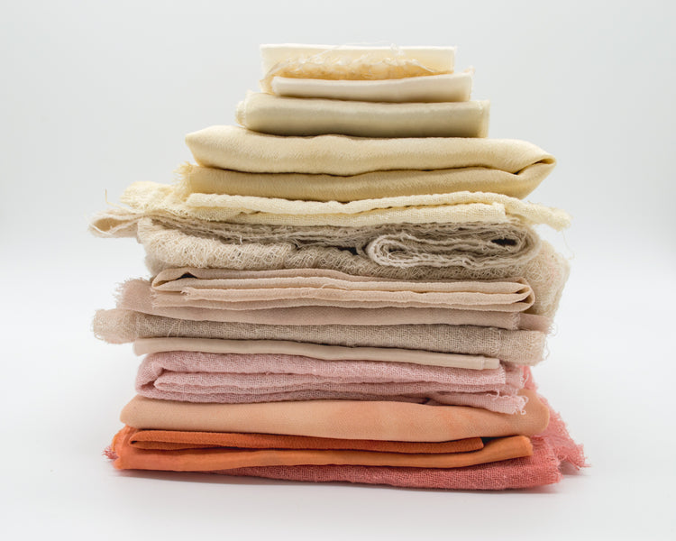 Pile of deadstock fabric wearwell's sustainability blog for ethical clothing and accessories